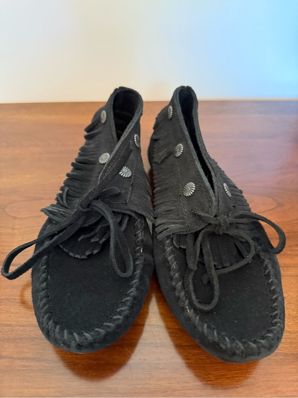 Minnetonka Black Fringe Moccasin with Conchos